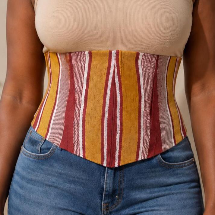 Mustard, burgundy and white Aso Oke corset belt worn over a white shirt, view 10