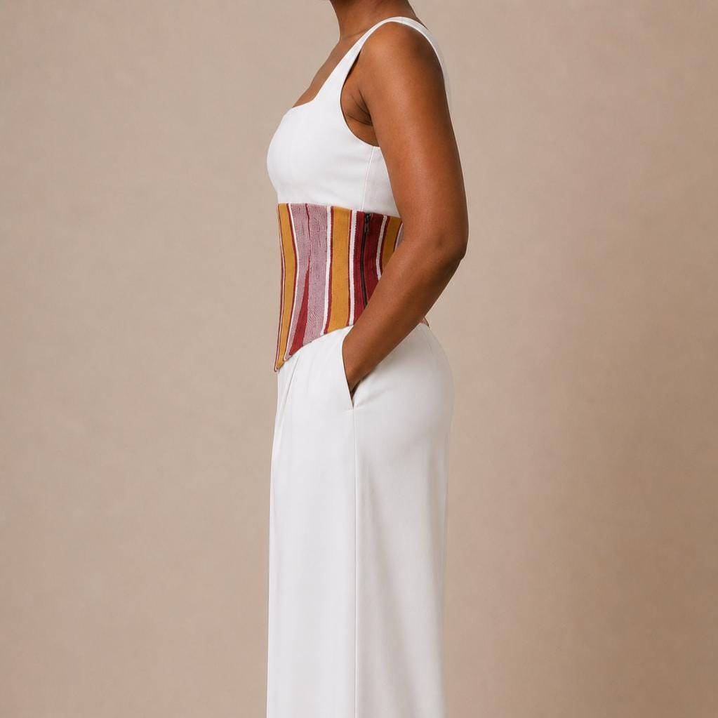 Mustard, burgundy and white Aso Oke corset belt worn over a white shirt, view 6