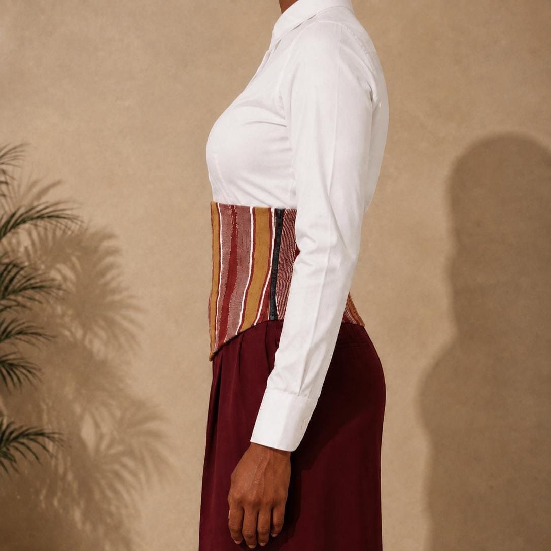 Mustard, burgundy and white Aso Oke corset belt worn over a white shirt, view 2